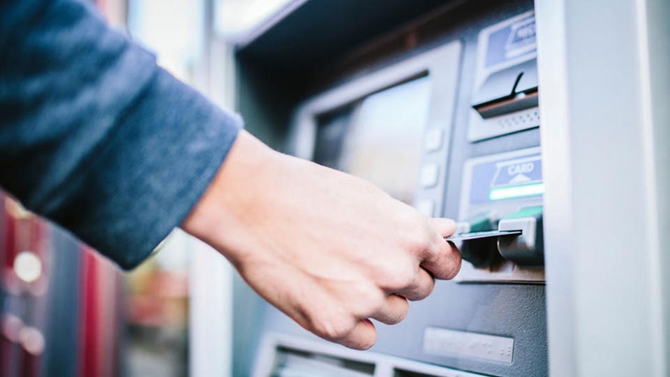 Person using ATM