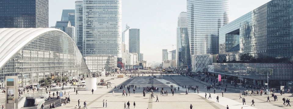 Open, modern, public square with people walking around