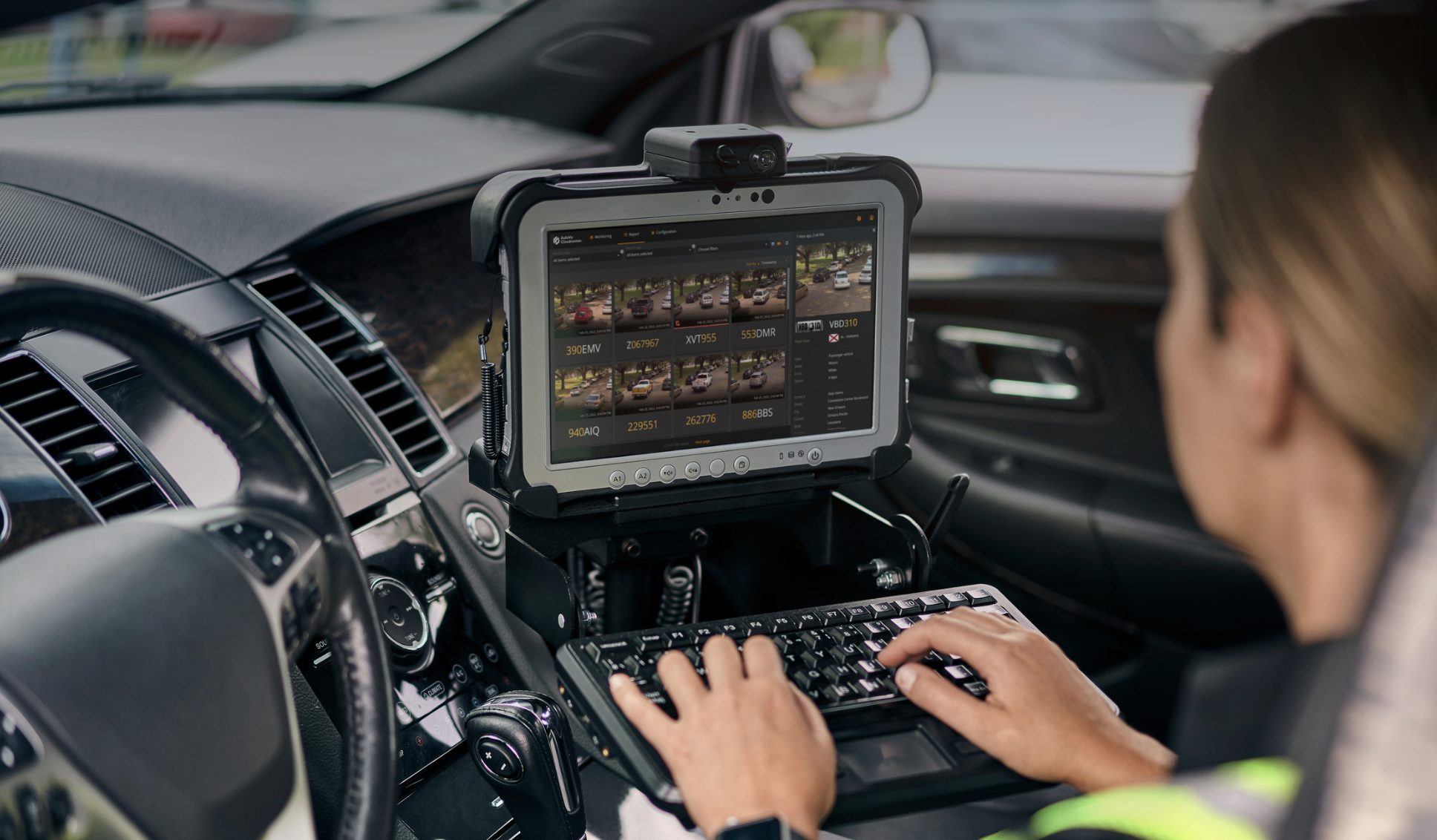 police officer looking at license plate images