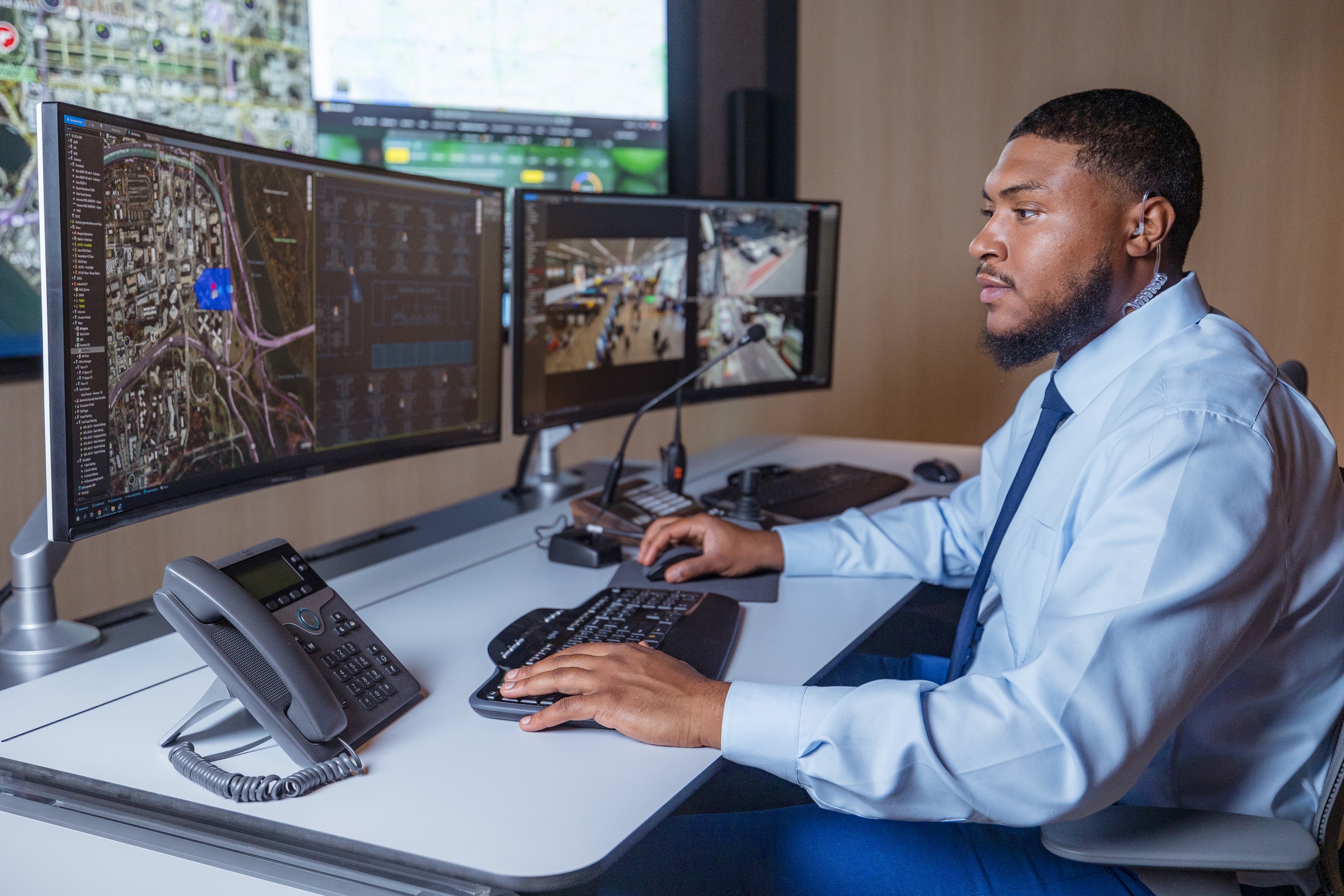 Security operator looking at video wall