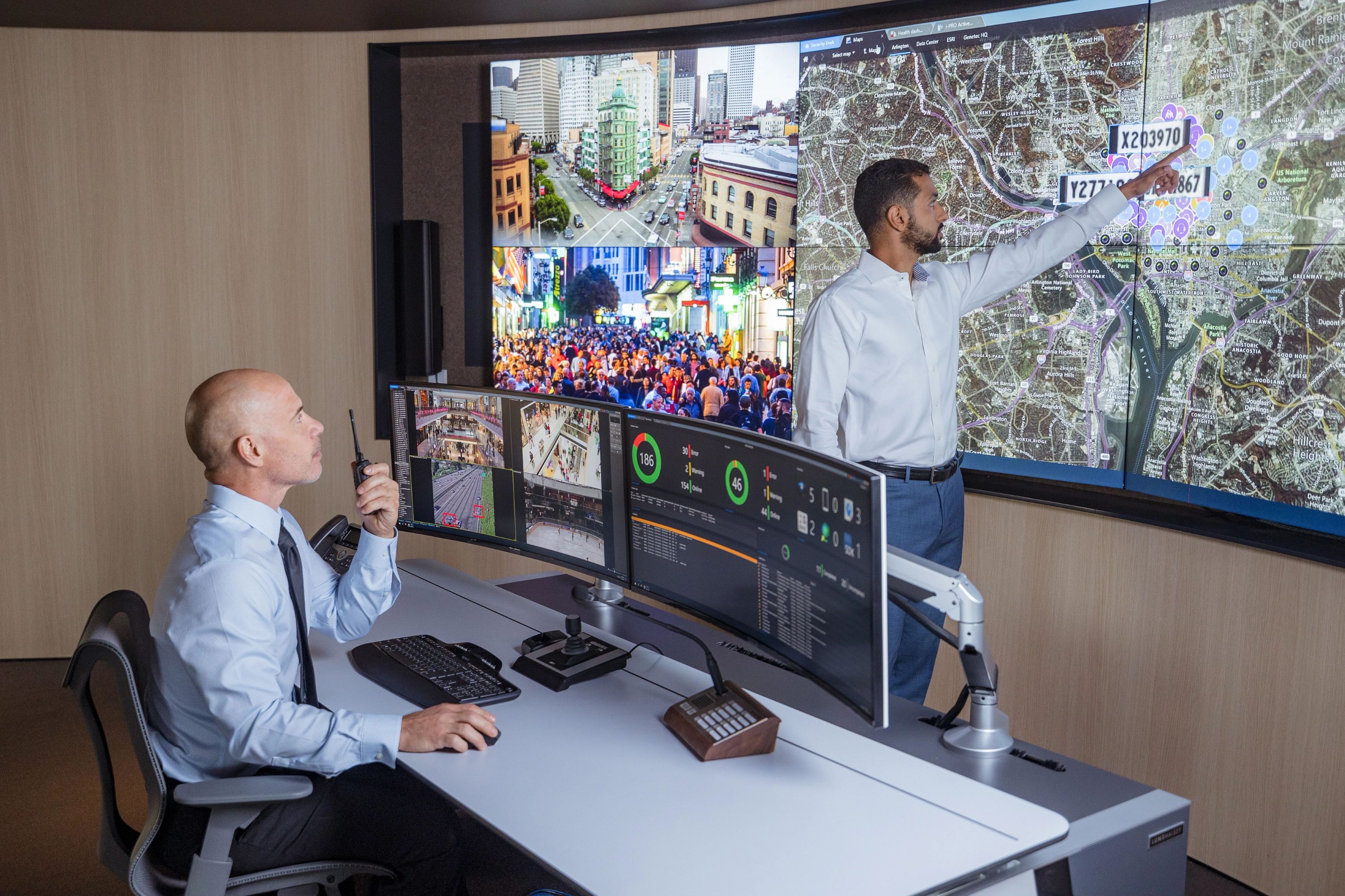 Security operators looking at video surveillance wall