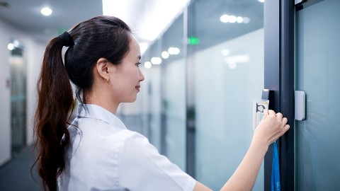woman scanning access control badge